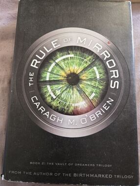 The Rule of Mirrors by Caragh M. O’Brien - Green Eye Cover